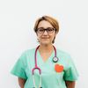 Portrait of Zoryana Klymchuk, a smiling practitioner from Chernivtsi.